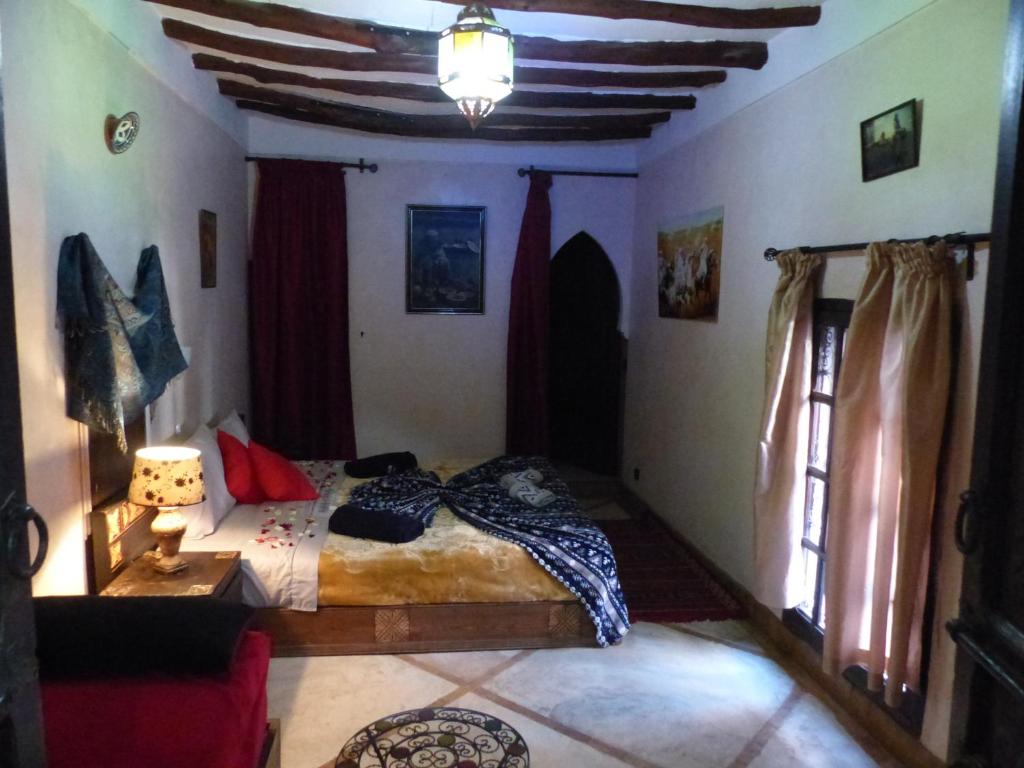 Postel nebo postele na pokoji v ubytování Riad Jakoura