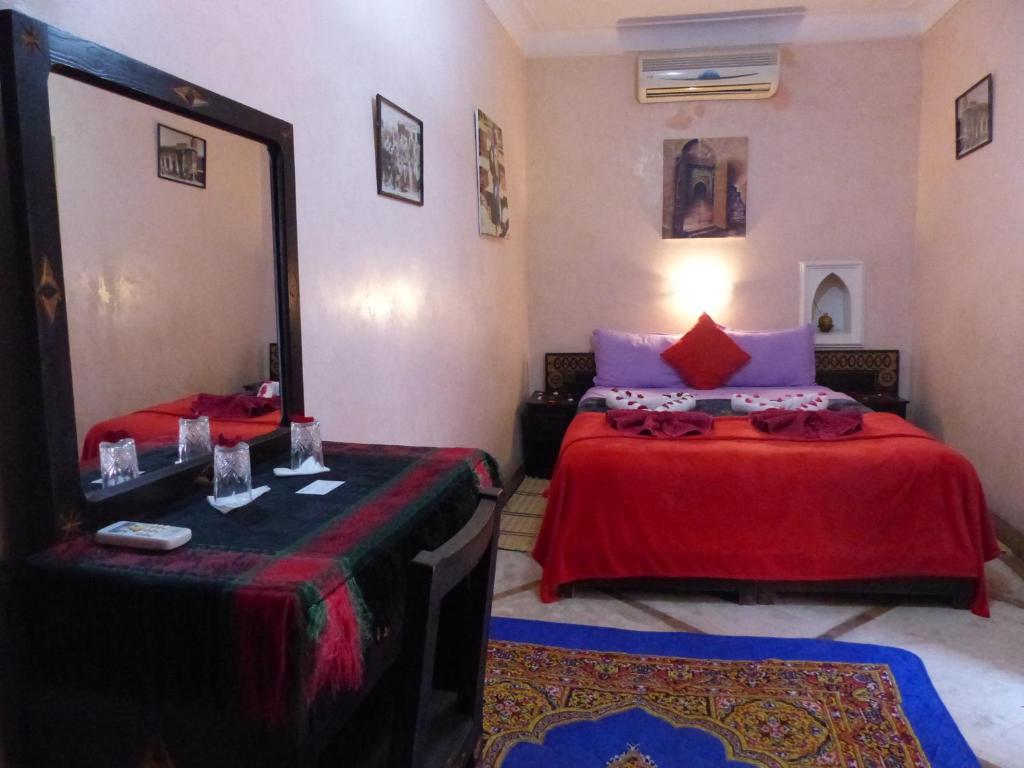 Postel nebo postele na pokoji v ubytování Riad Jakoura