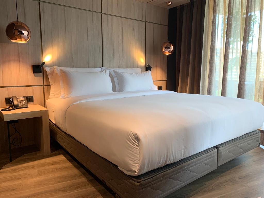Postel nebo postele na pokoji v ubytování One Nk Apartments