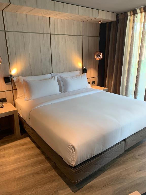 Postel nebo postele na pokoji v ubytování One Nk Apartments