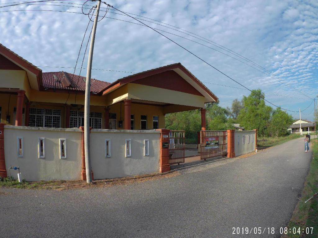 a house on the side of a road at Oriental Homestay Dungun in Dungun