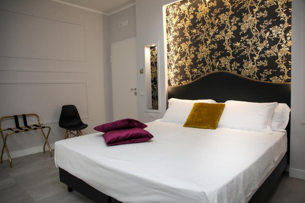 Ένα ή περισσότερα κρεβάτια σε δωμάτιο στο Principessa Isabella Luxury Rooms