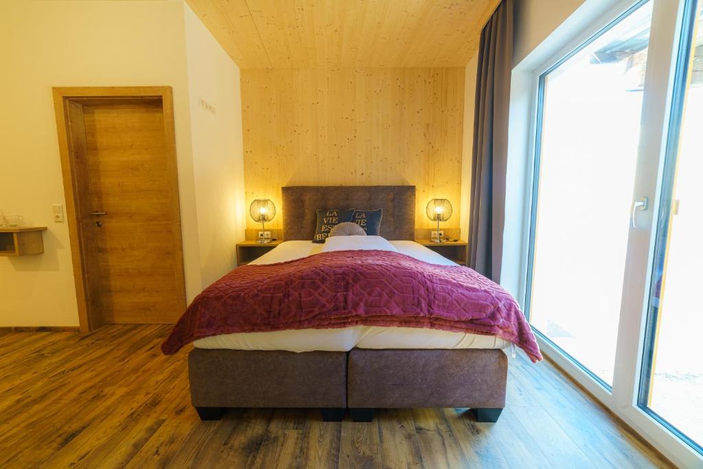 Postel nebo postele na pokoji v ubytování Harrauer´s Living
