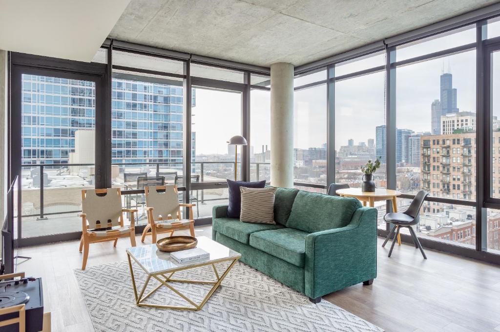 a living room filled with furniture and a large window at Sonder South Wabash in Chicago
