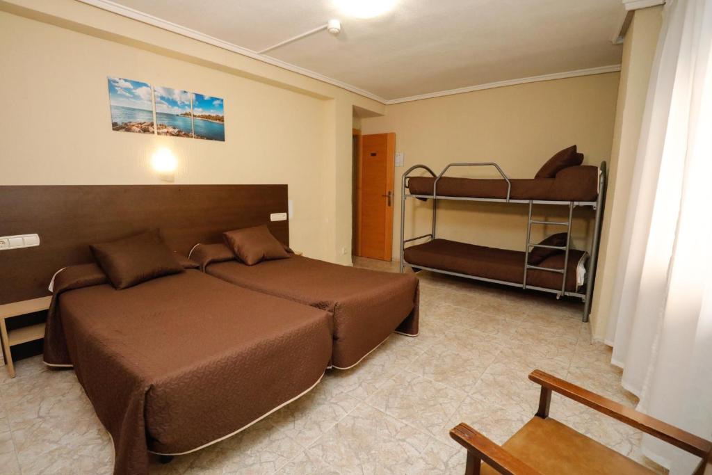 Postel nebo postele na pokoji v ubytování Hostal Conde David