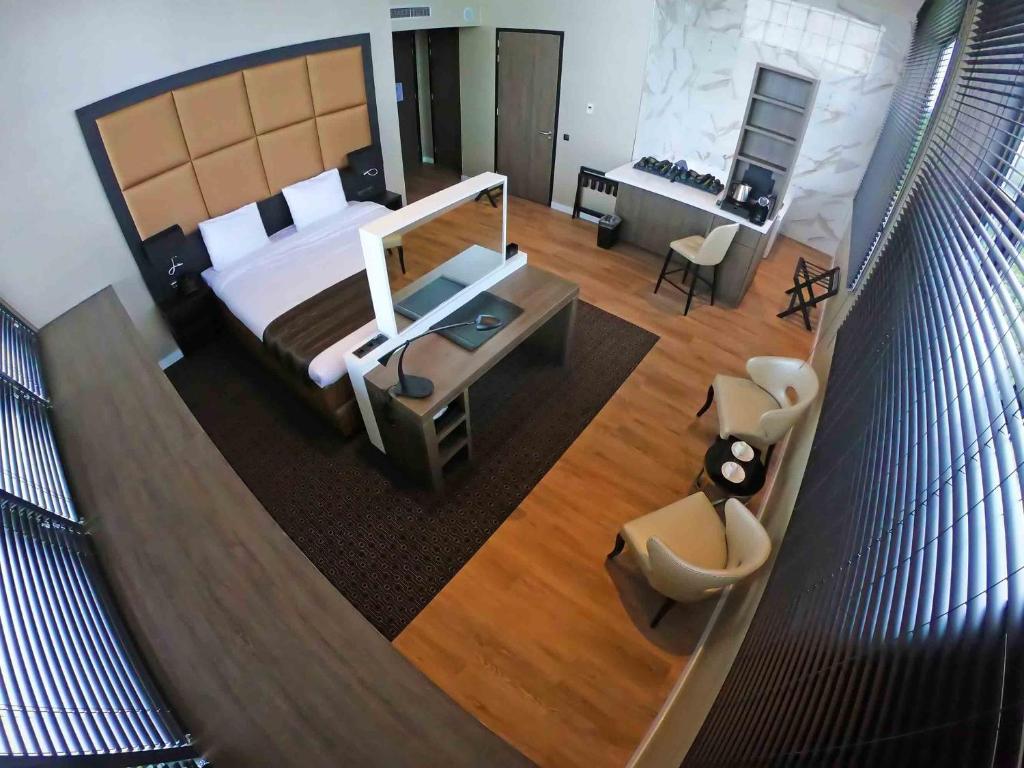 Postel nebo postele na pokoji v ubytování Riva hotel Den Haag - Delft