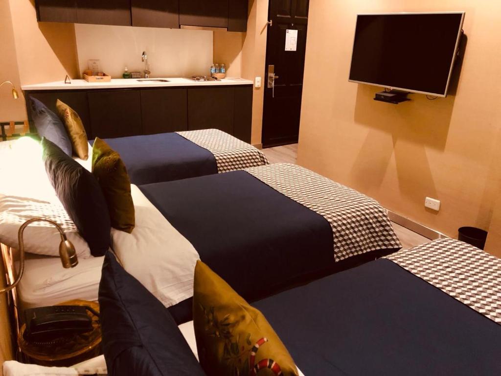 Postel nebo postele na pokoji v ubytování Hotel Regina