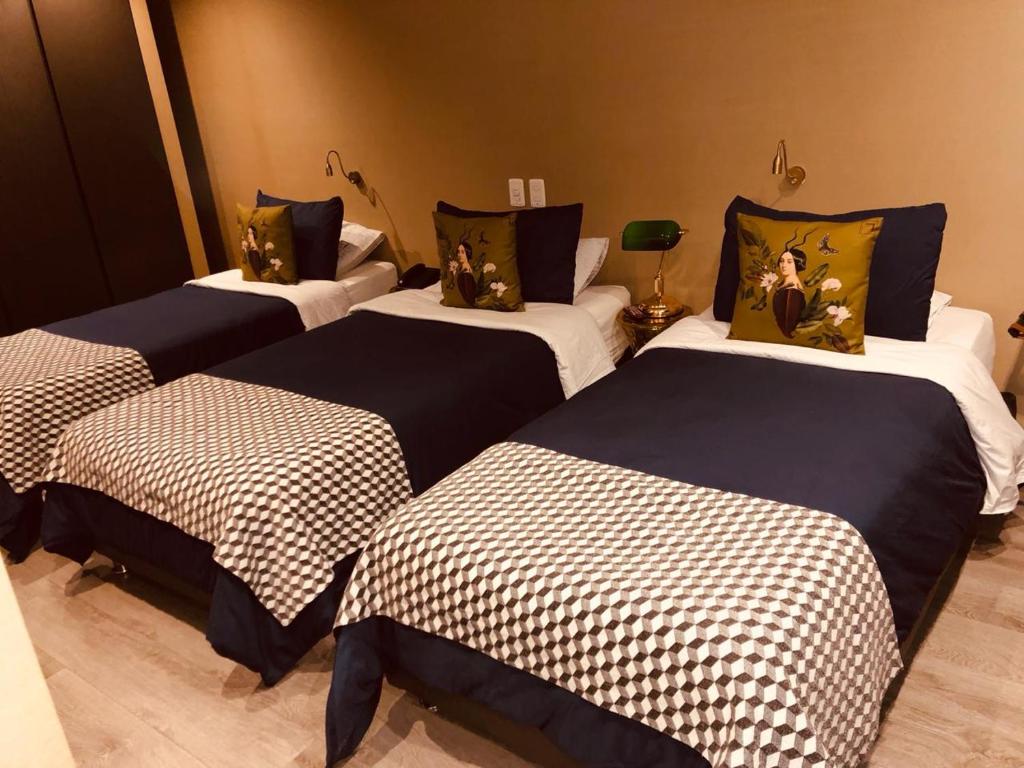Postel nebo postele na pokoji v ubytování Hotel Regina