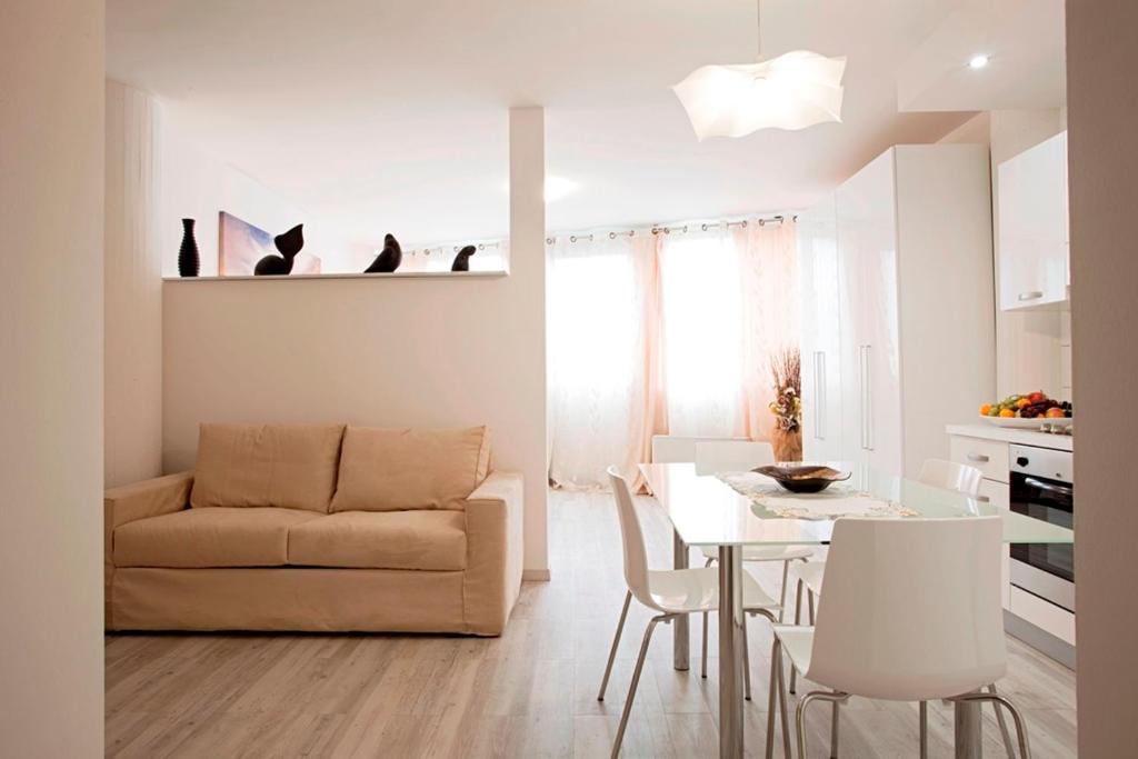 a living room with a couch and a table at Residence Ferrucci in Prato