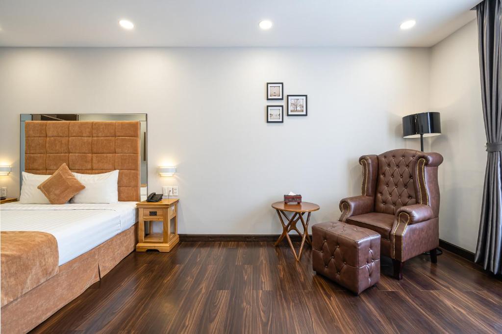 Postel nebo postele na pokoji v ubytování Emerald Central