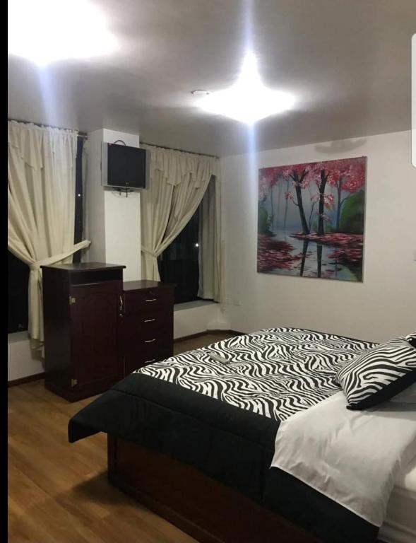 Postel nebo postele na pokoji v ubytování Loreto hotel