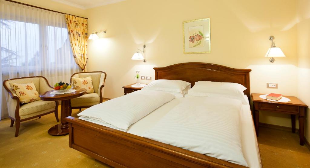Postel nebo postele na pokoji v ubytování Hotel Aster