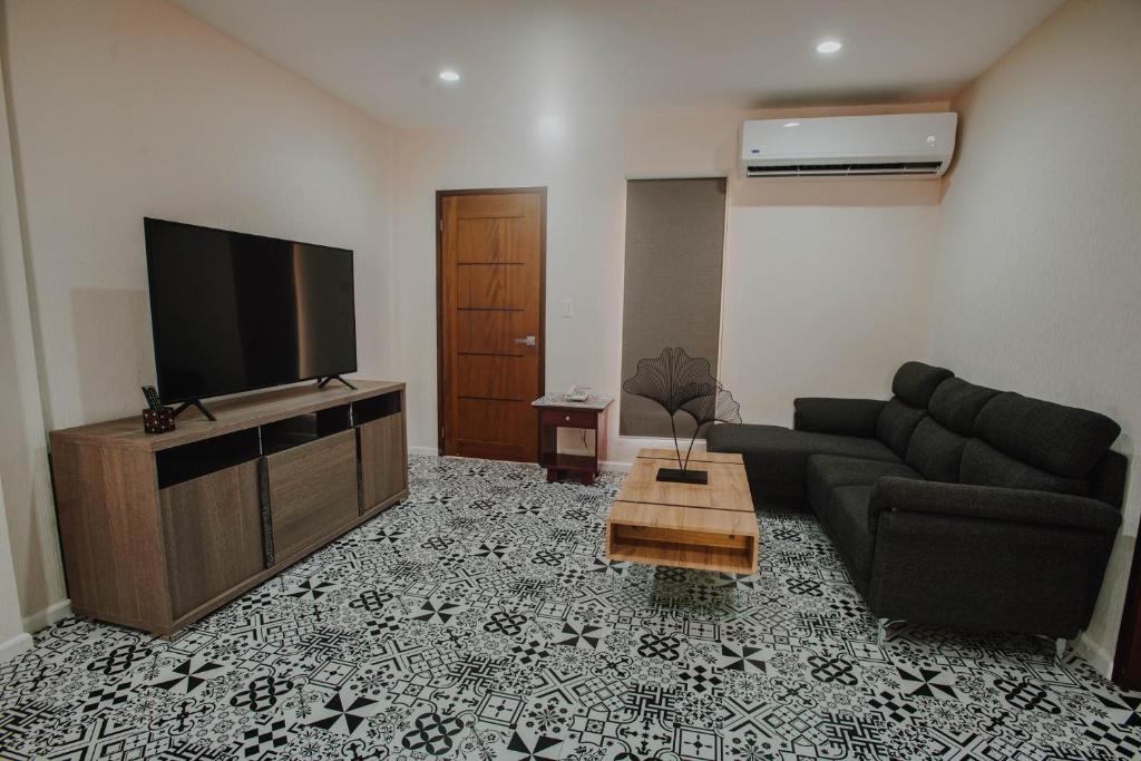 TV a/nebo společenská místnost v ubytování Segara Residencias
