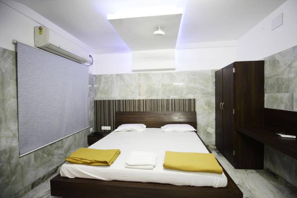Postel nebo postele na pokoji v ubytování Hotel Joyce