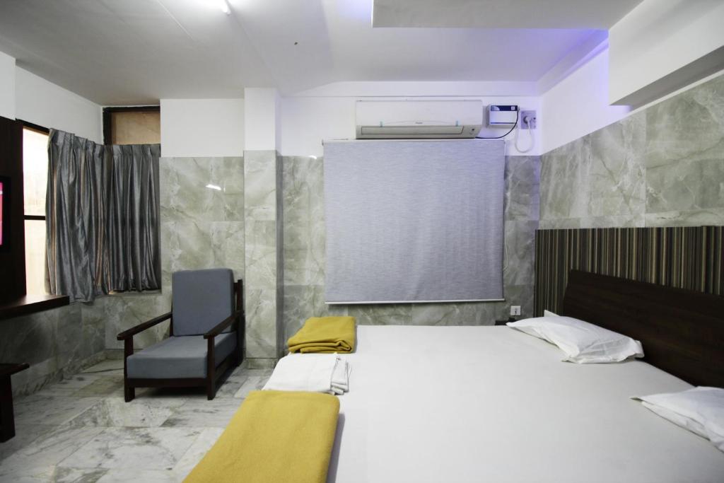 Postel nebo postele na pokoji v ubytování Hotel Joyce