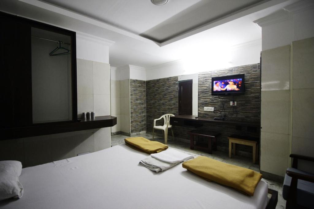 Postel nebo postele na pokoji v ubytování Hotel Joyce