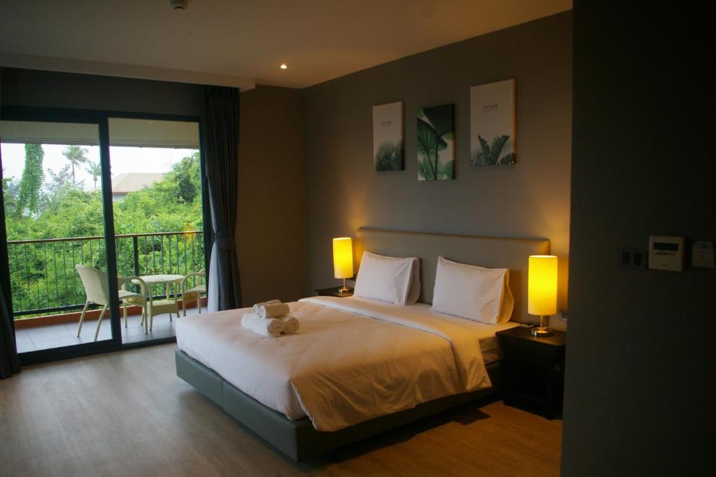 Posteľ alebo postele v izbe v ubytovaní Aonang Inn