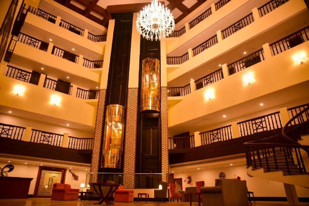 a large building with a chandelier in the middle at AVS Imperiaa Karaikal in kāraikāl