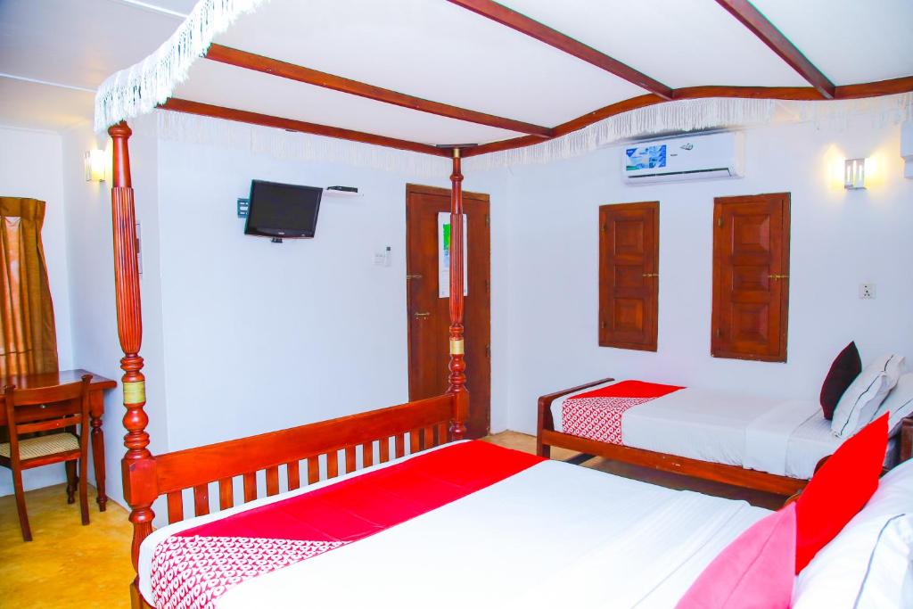 Postel nebo postele na pokoji v ubytování Hotel Nawathana