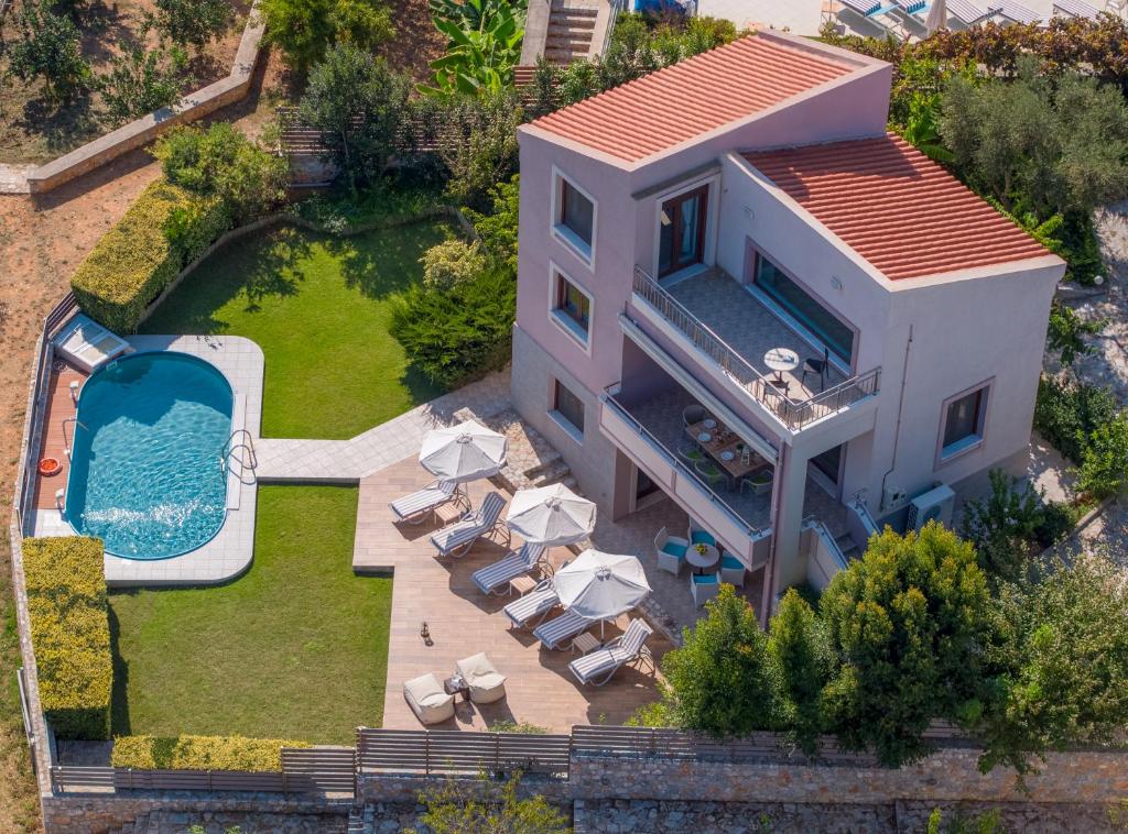 an aerial view of a house with a swimming pool at Villa Stefania in Kato Galatas