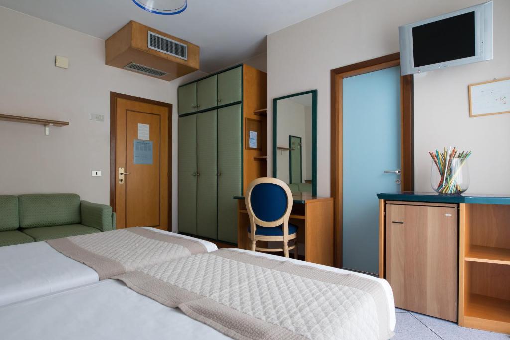 Postel nebo postele na pokoji v ubytování Hotel Monaco & Quisisana