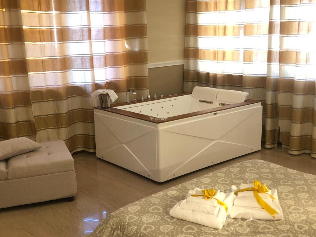 Postel nebo postele na pokoji v ubytování Villa Domus Salento Suites & Rooms con parcheggio privato in loco