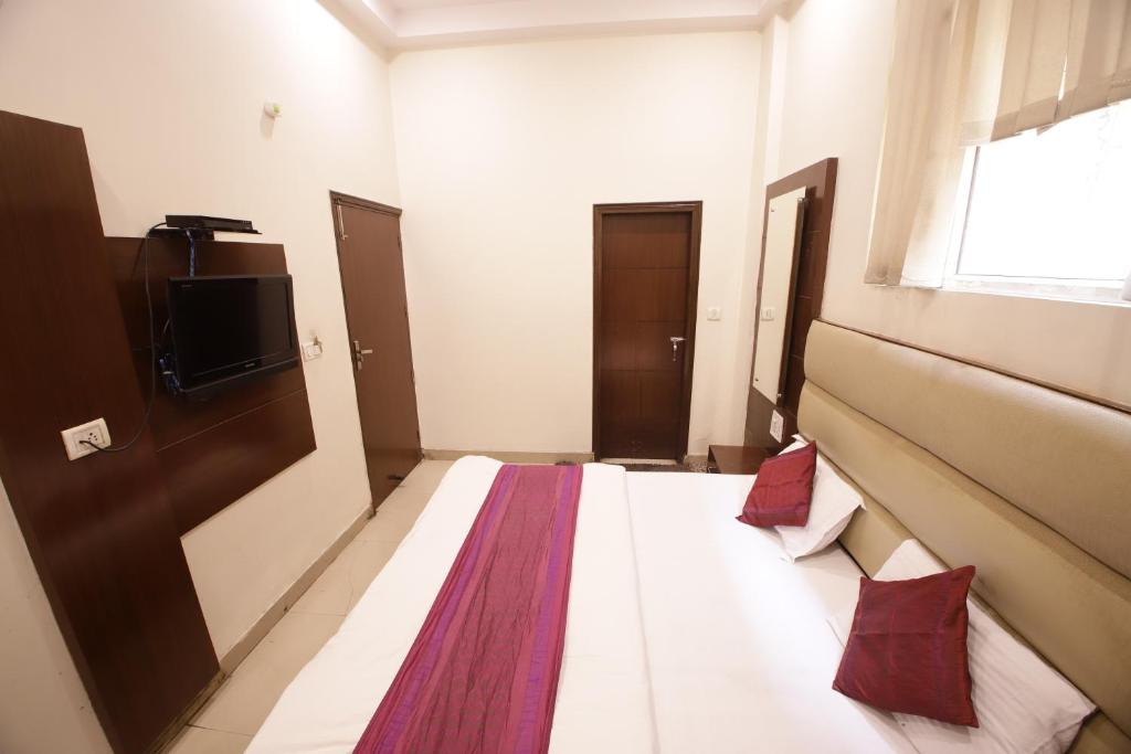 Postel nebo postele na pokoji v ubytování Hotel Golden Wings