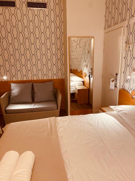 Postel nebo postele na pokoji v ubytování Hotel Montecarlo - Vista Mare con Piscina & Area Fitness