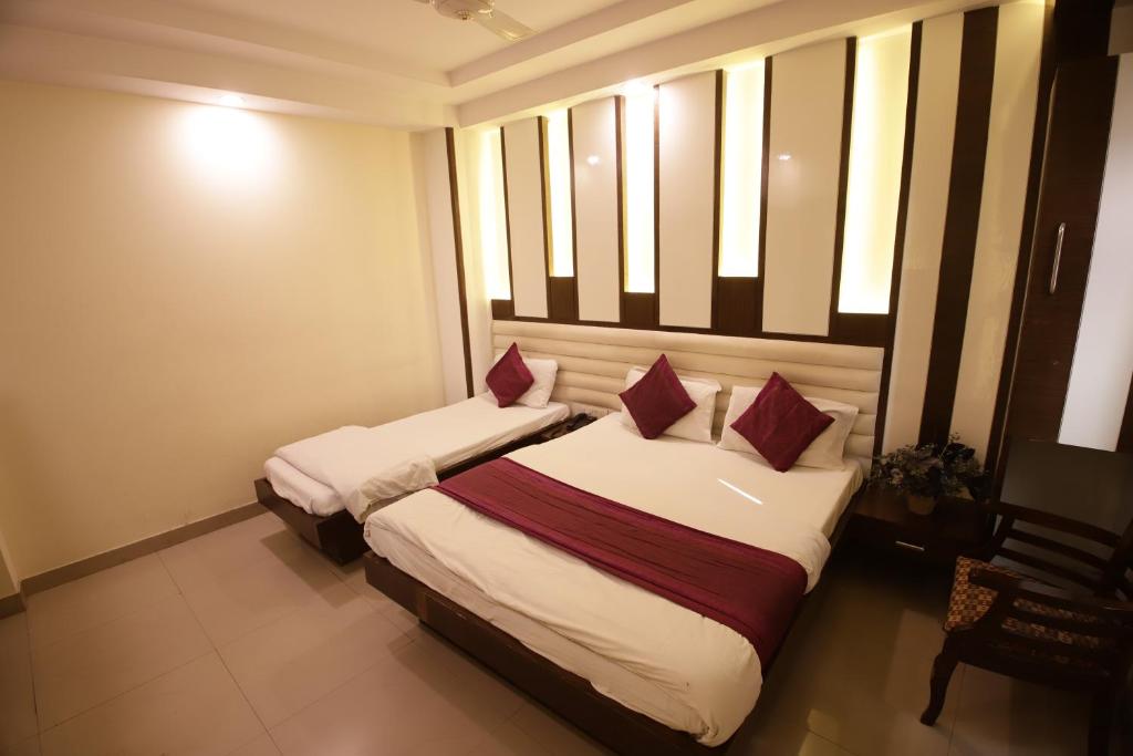 Postel nebo postele na pokoji v ubytování Hotel Golden Wings