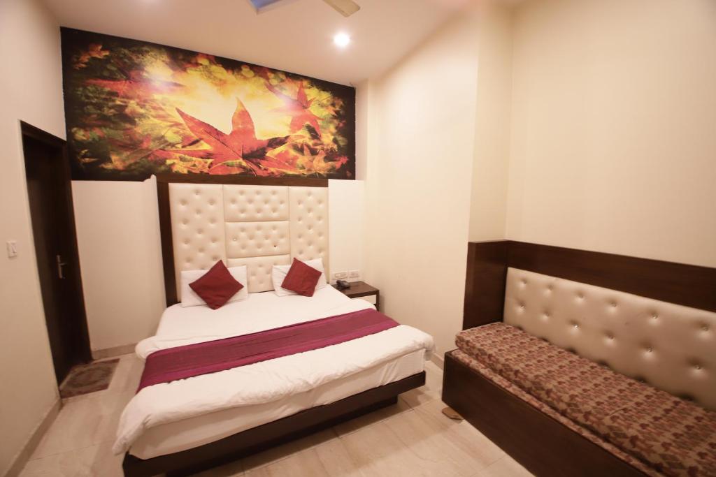 Postel nebo postele na pokoji v ubytování Hotel Golden Wings