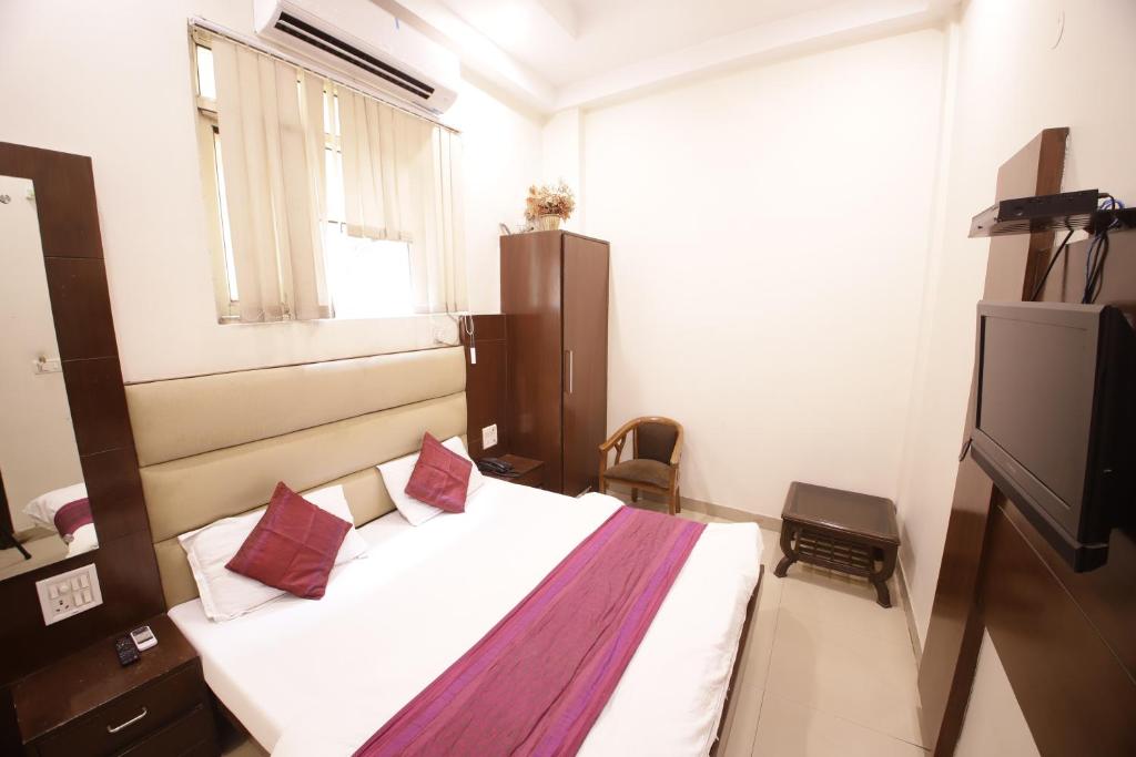 Postel nebo postele na pokoji v ubytování Hotel Golden Wings