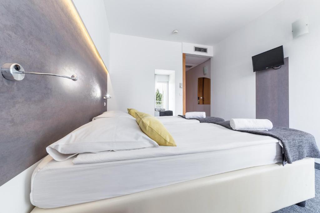 Posteľ alebo postele v izbe v ubytovaní Hotel Punta