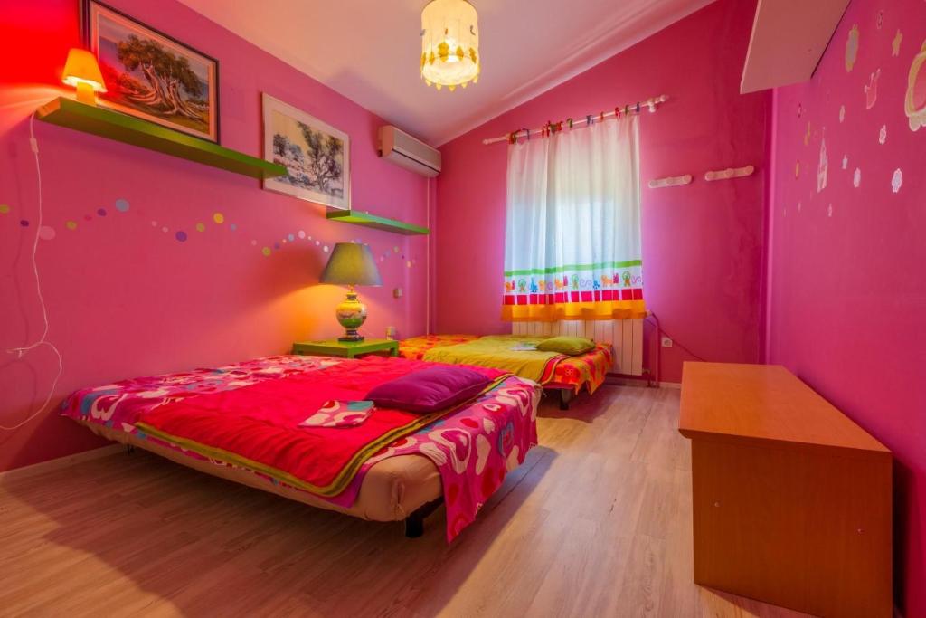 Postel nebo postele na pokoji v ubytování VILLA VANNA