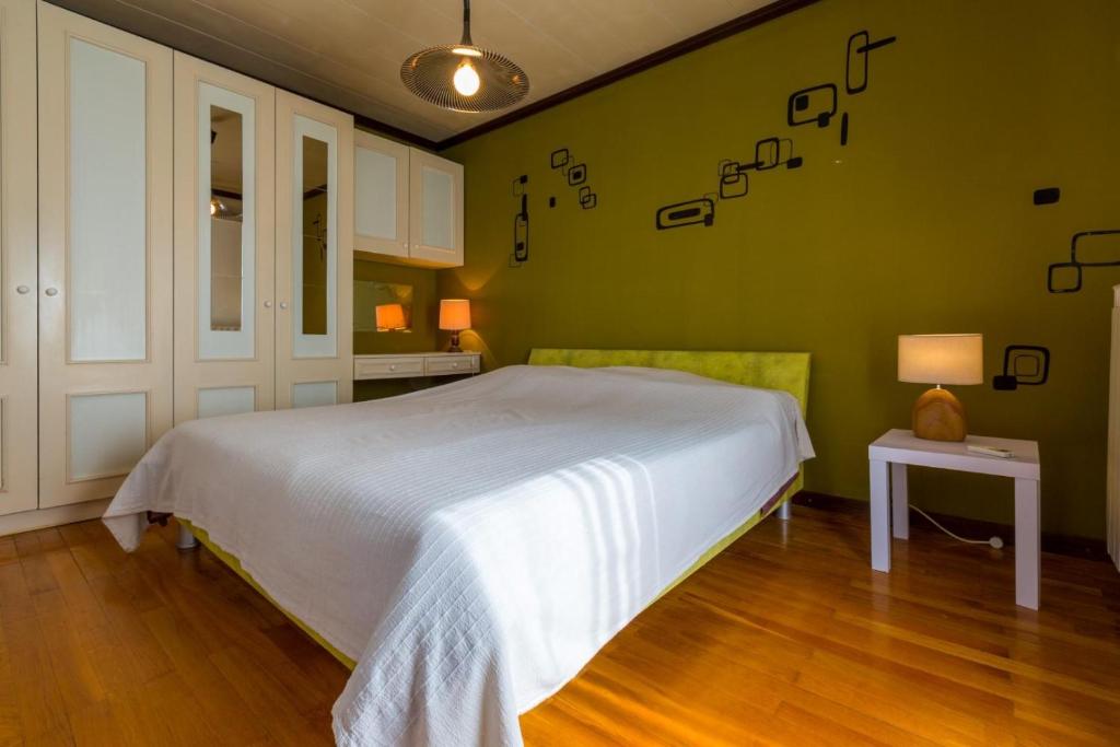 Postel nebo postele na pokoji v ubytování VILLA VANNA