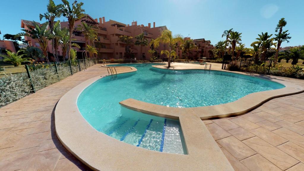 a swimming pool in the middle of a resort at Casa Kazamour - A Murcia Holiday Rentals Property in Torre-Pacheco