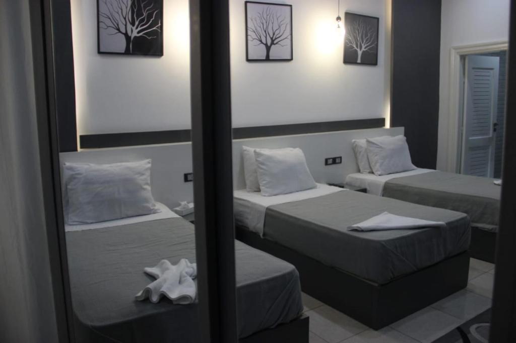 Postel nebo postele na pokoji v ubytování Azar Boutique Hotel