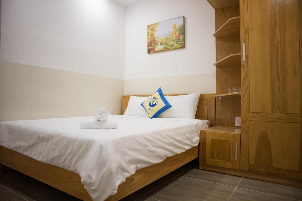 Postel nebo postele na pokoji v ubytování BaLi Motel Vung Tau