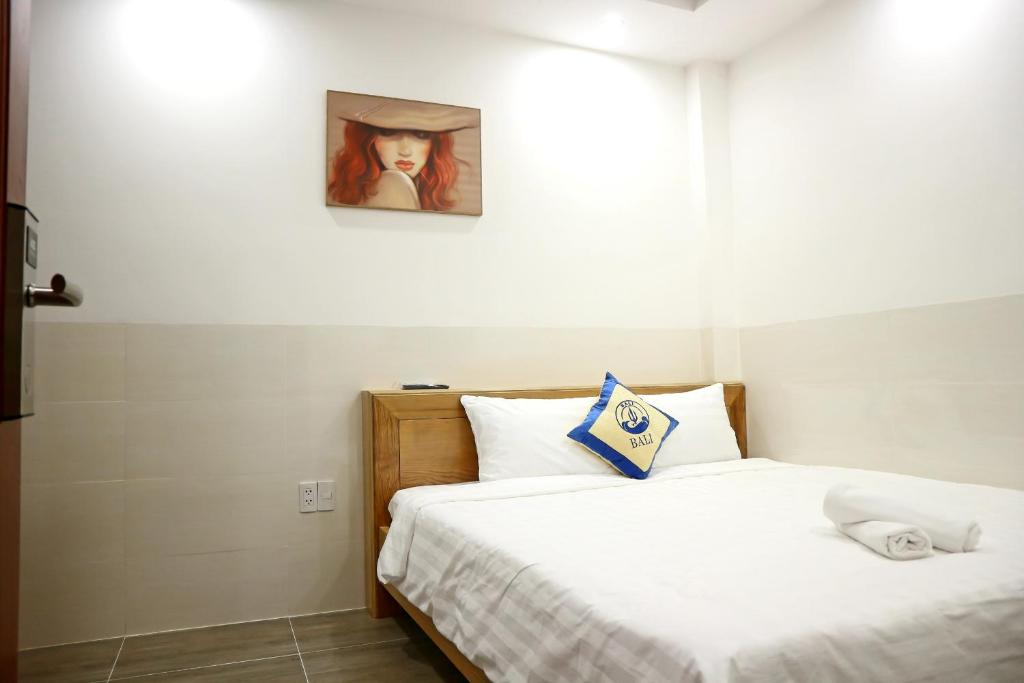 Postel nebo postele na pokoji v ubytování BaLi Motel Vung Tau