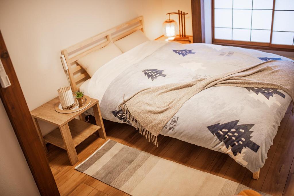 Postel nebo postele na pokoji v ubytování KONAYUKI