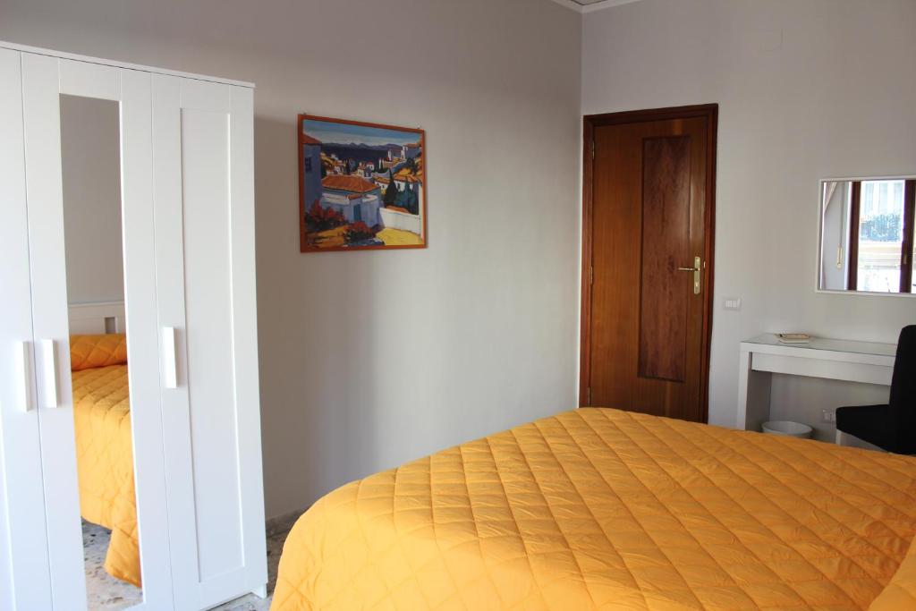 Łóżko lub łóżka w pokoju w obiekcie San Vitale House