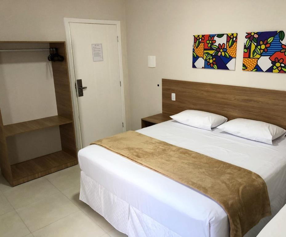 Postel nebo postele na pokoji v ubytování Hotel QualitySul