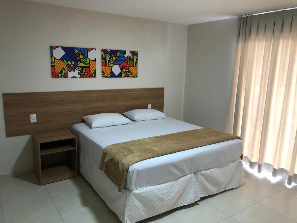 Postel nebo postele na pokoji v ubytování Hotel QualitySul