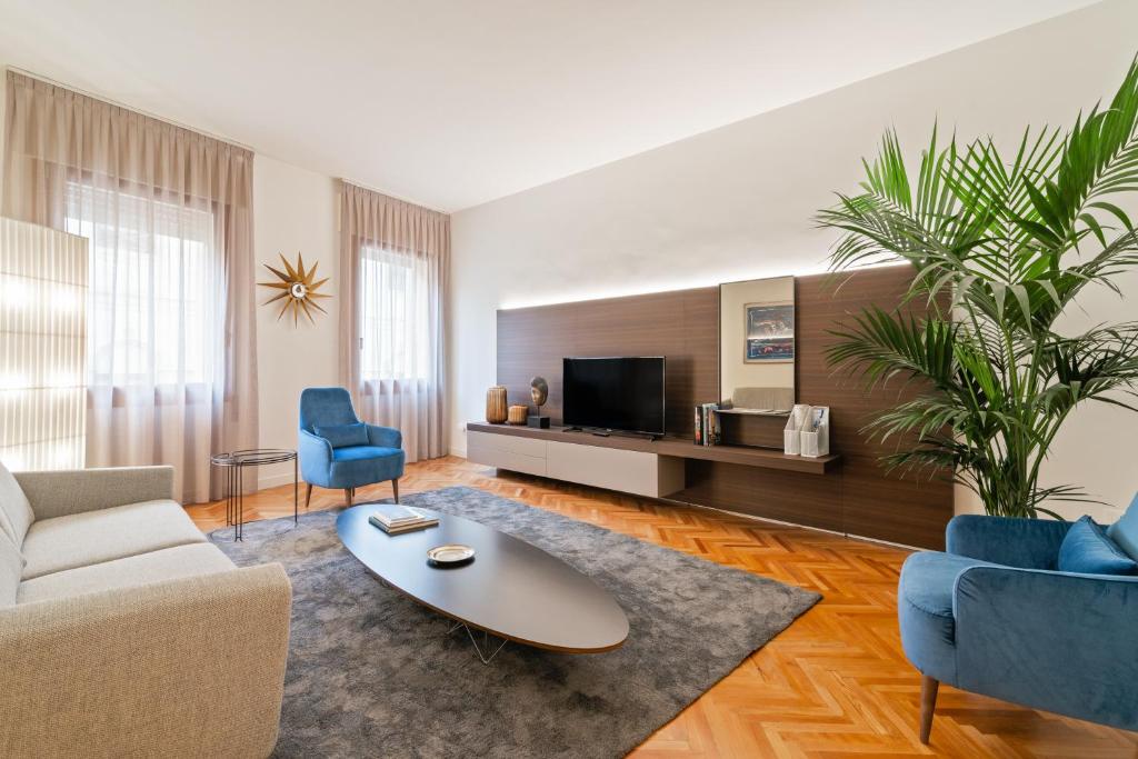 a living room with a couch and a coffee table at San Fermo Luxury Apartment in Padova