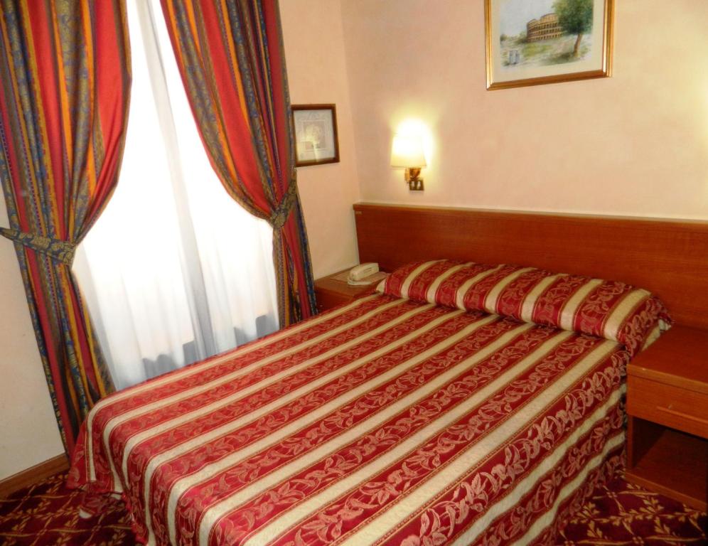 Postel nebo postele na pokoji v ubytování Buonarroti Home
