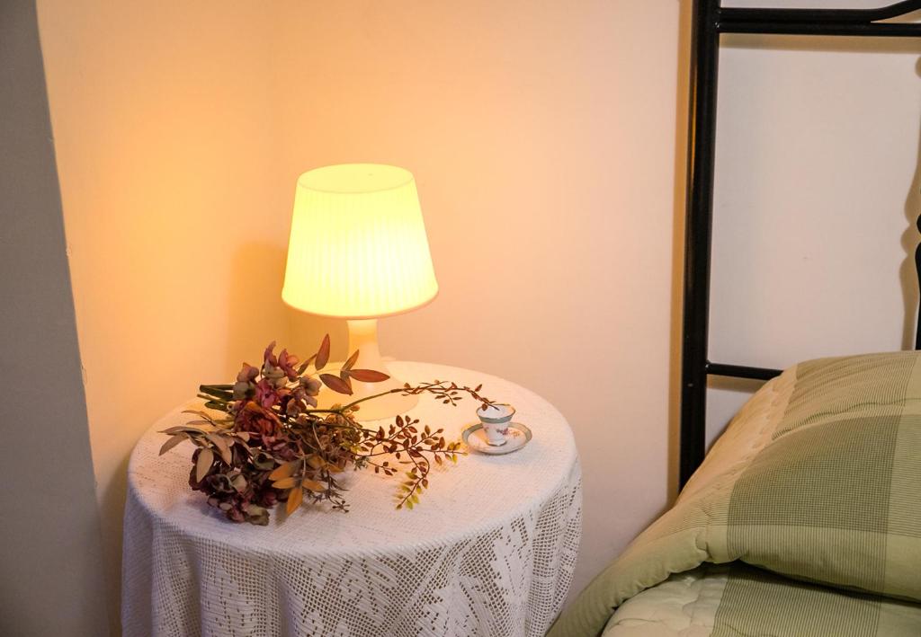 A bed or beds in a room at Il Normanno Home
