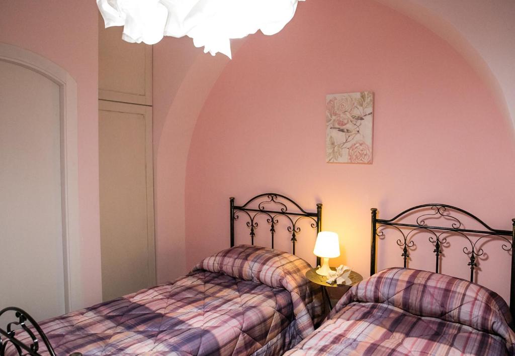A bed or beds in a room at Il Normanno Home