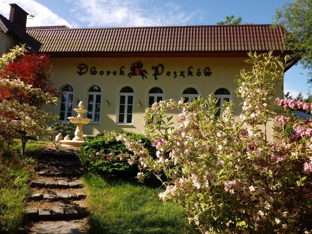 a building with a sign that reads planet pastile at DWOREK PESZKÓW in Głubczyce