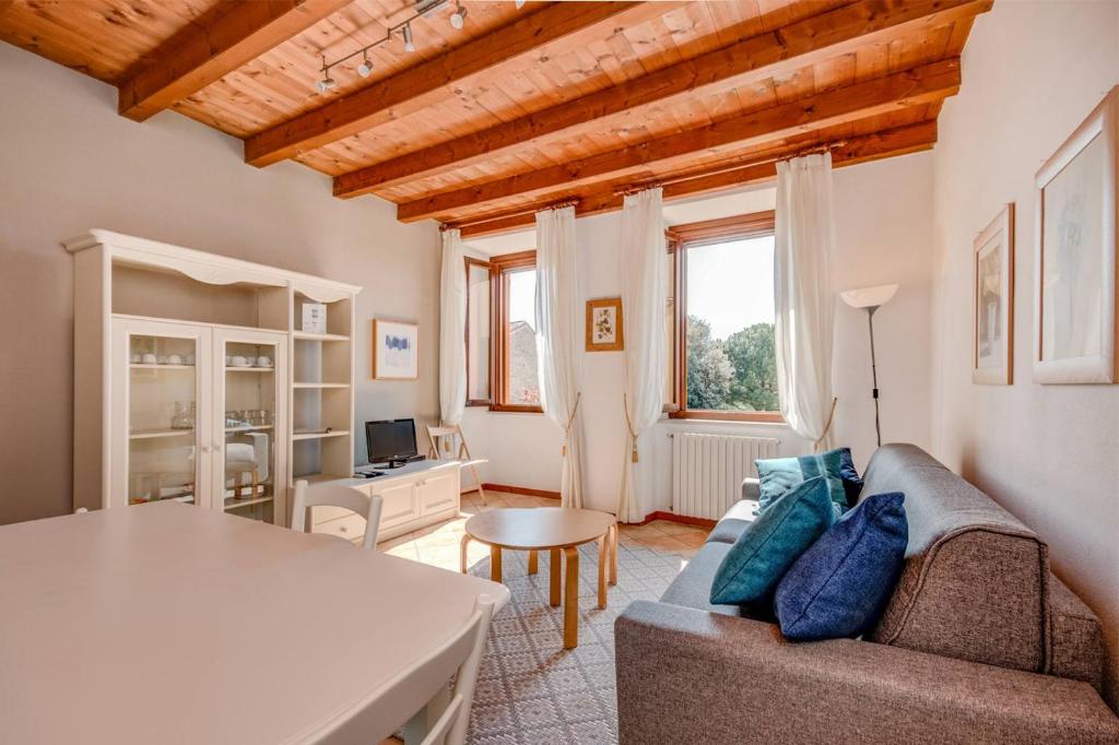 a living room with a couch and a table at Agriturismo La Filanda in Manerba del Garda