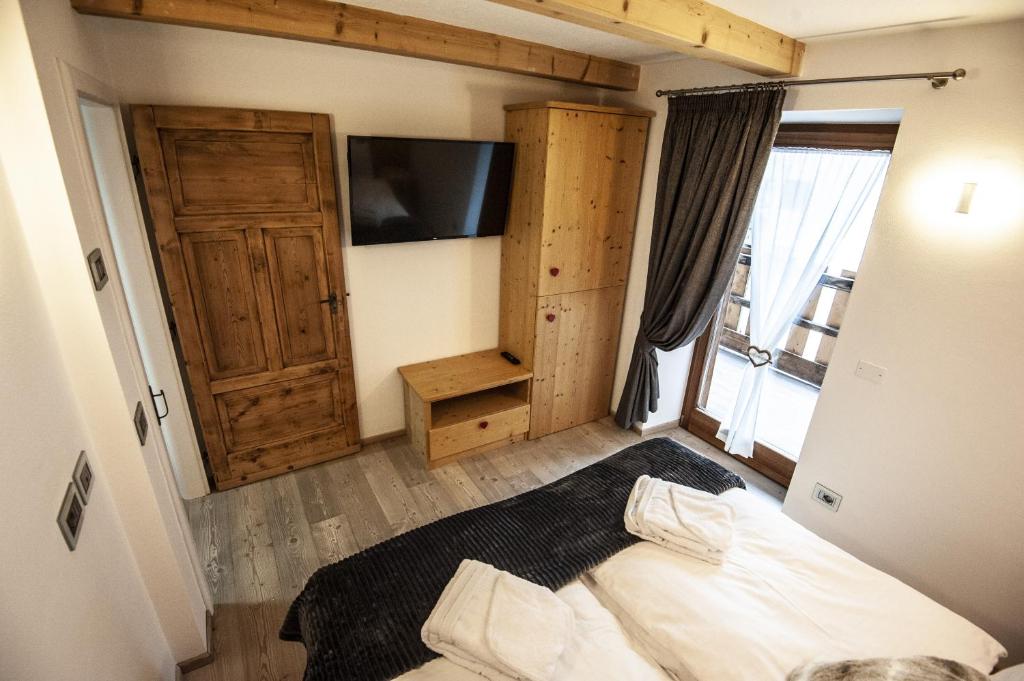 Posteľ alebo postele v izbe v ubytovaní Chalet Tobià