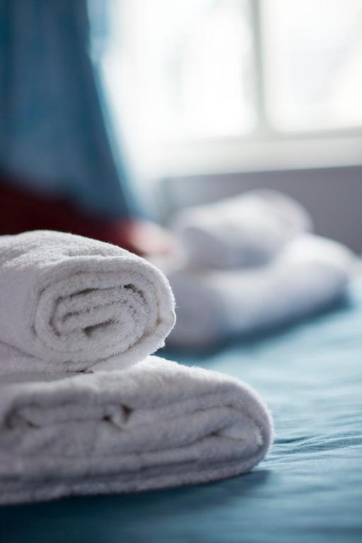 Postel nebo postele na pokoji v ubytování Hôtel Le Chantilly